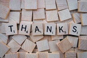 the words "thank you" as scrabble pieces